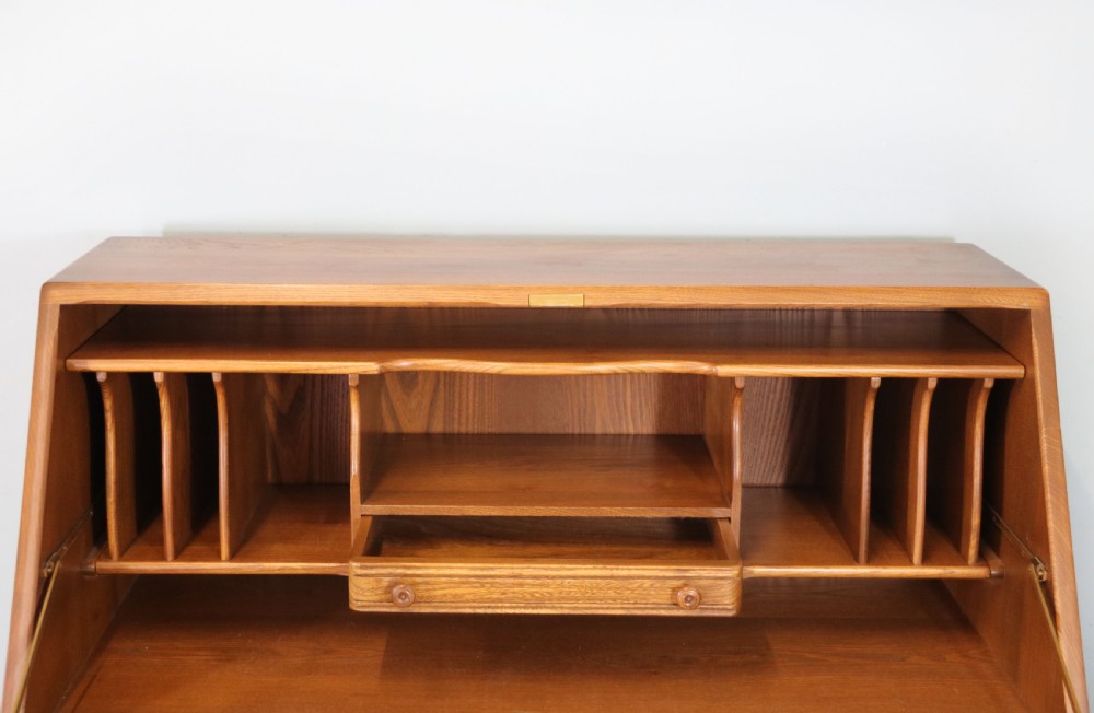  A lovely piece of modern Ercol light elm bureau. View XIII