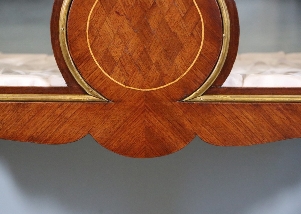 A mahogany and kingwood veneered bijouterie display table featuring glazed panels, cabriole legs with brass mounts, and a buttoned cream interior. View XIX