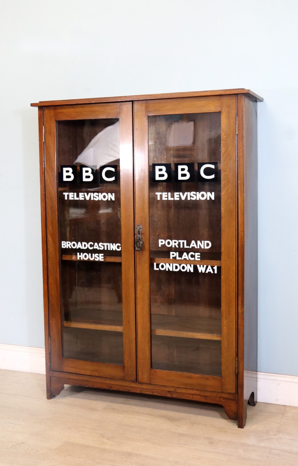 A mid-century glazed two door bookcase cabinet. View II