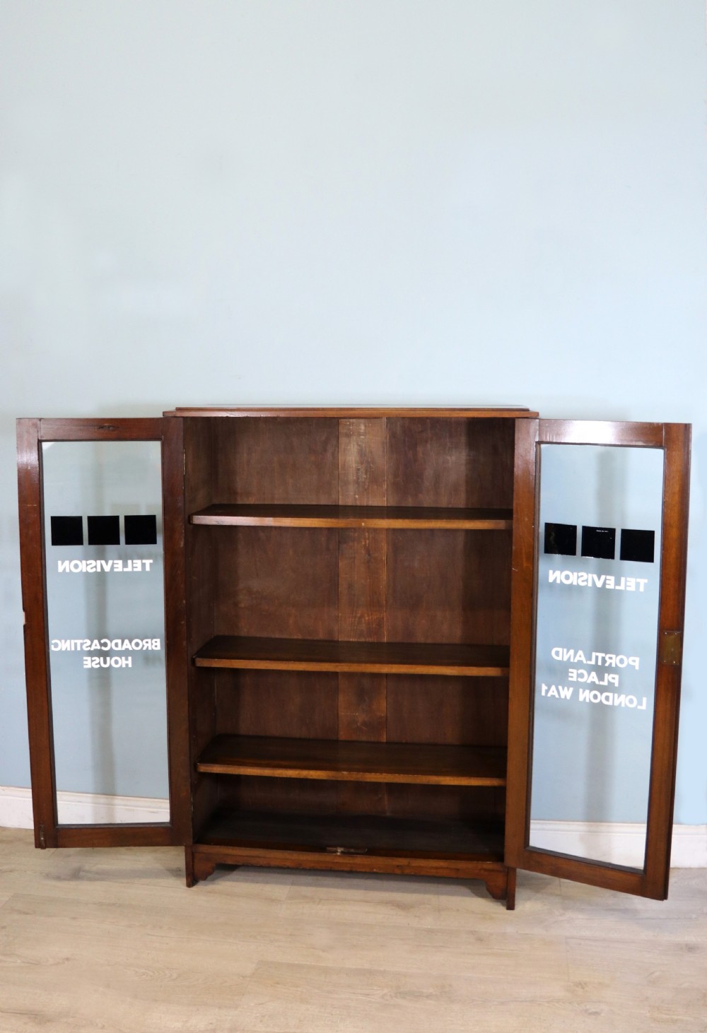 A mid-century glazed two door bookcase cabinet. View III