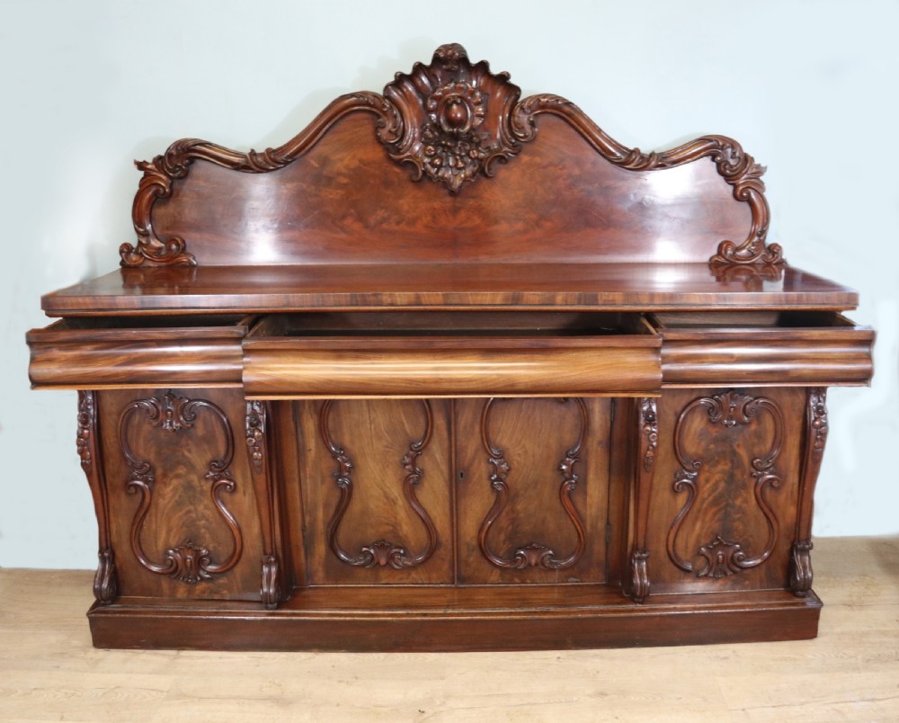 A superb antique mahogany sideboard of large proportions.  View II