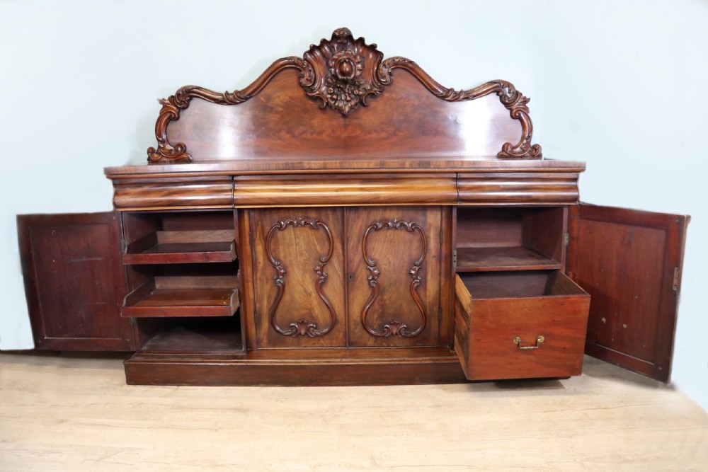 A superb antique mahogany sideboard of large proportions.  View IV