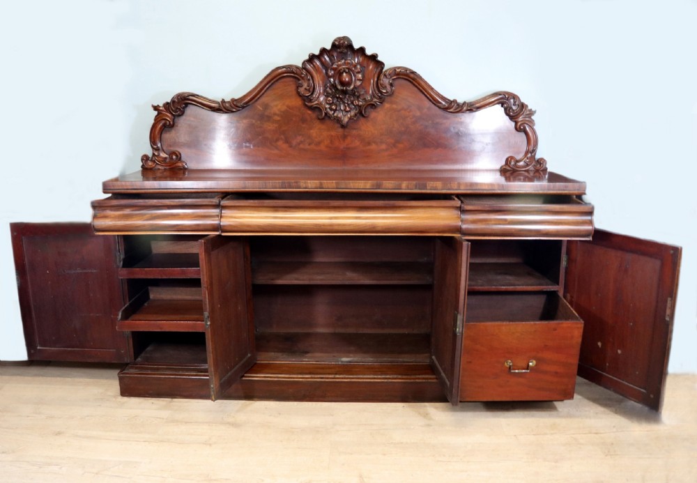 A superb antique mahogany sideboard of large proportions.  View V