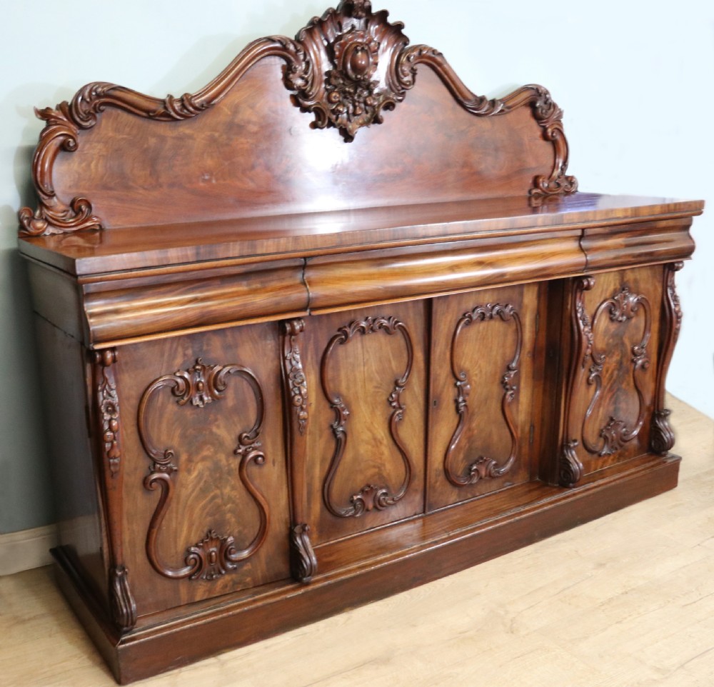 A superb antique mahogany sideboard of large proportions.  View VI