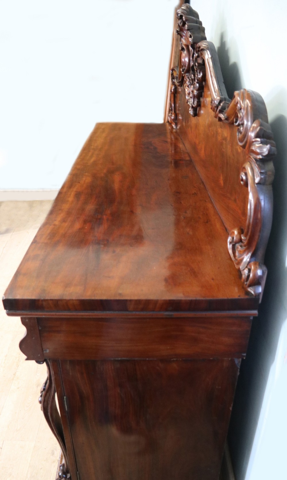 A superb antique mahogany sideboard of large proportions.  View VII
