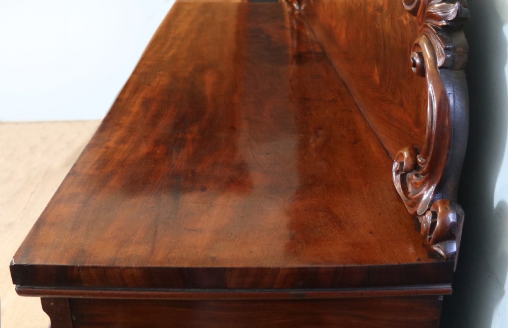 A superb antique mahogany sideboard of large proportions.  View VIII