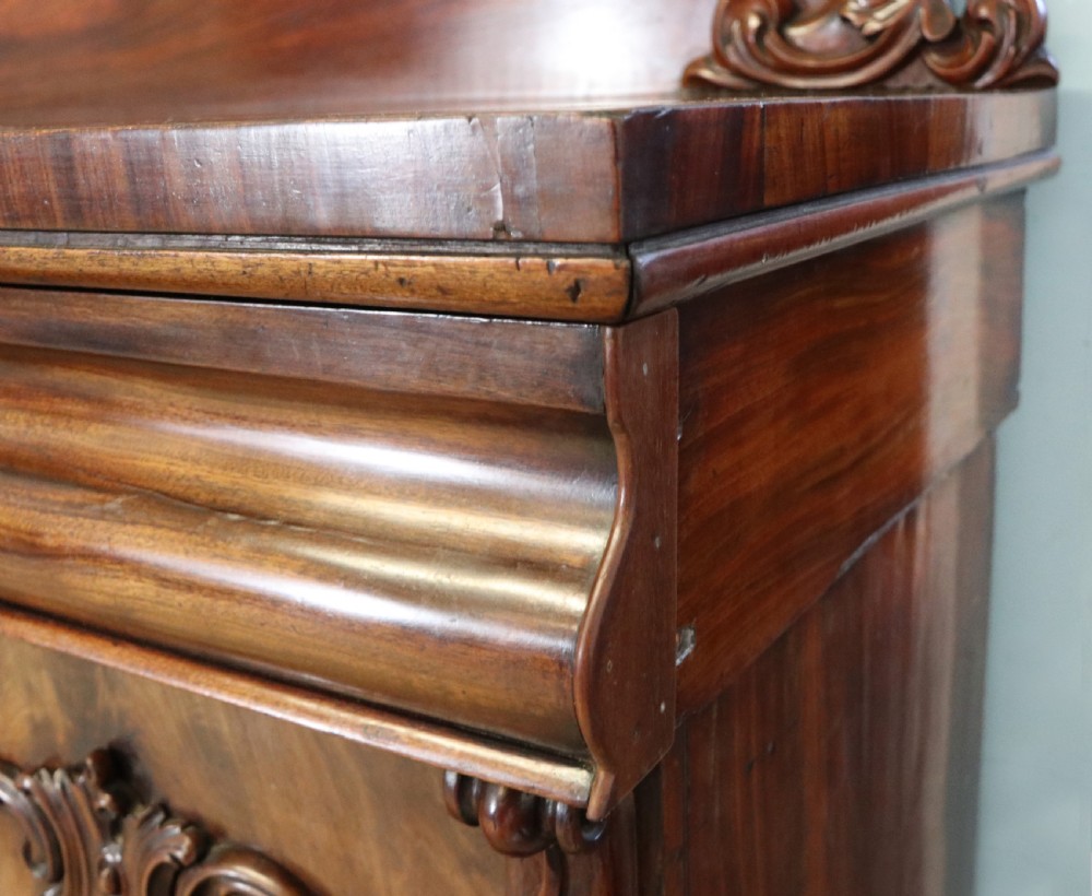 A superb antique mahogany sideboard of large proportions.  View XX