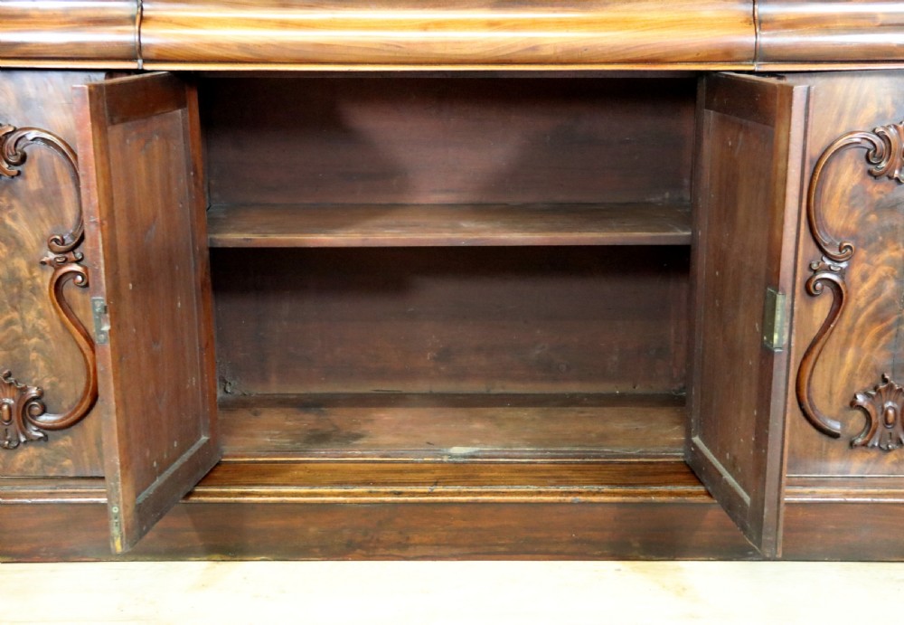 A superb antique mahogany sideboard of large proportions.  View XXX