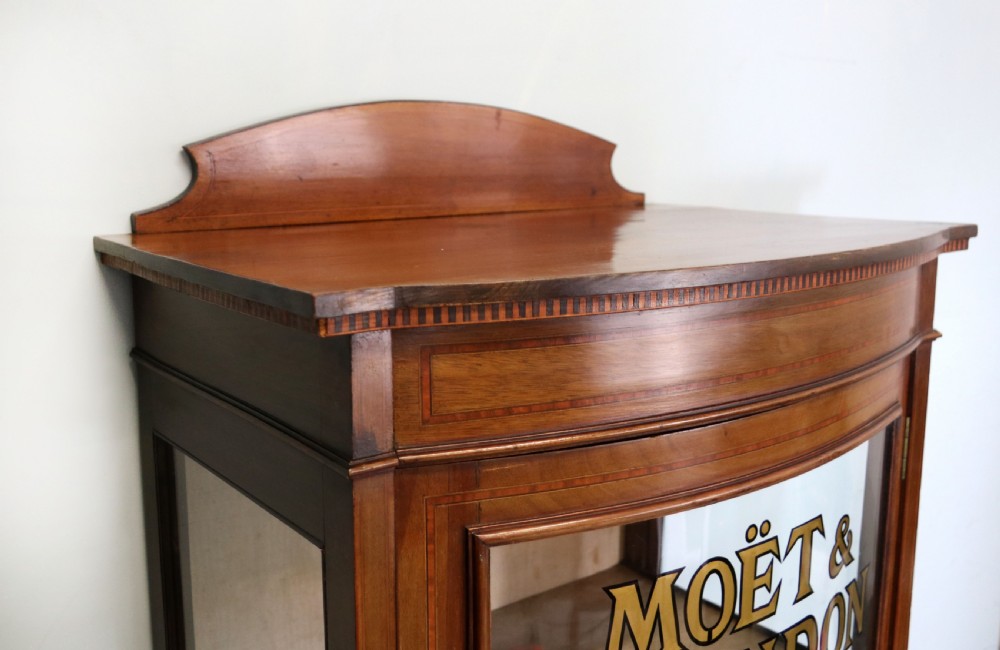 A lovely Edwardian mahogany framed bow fronted display cabinet. View IV