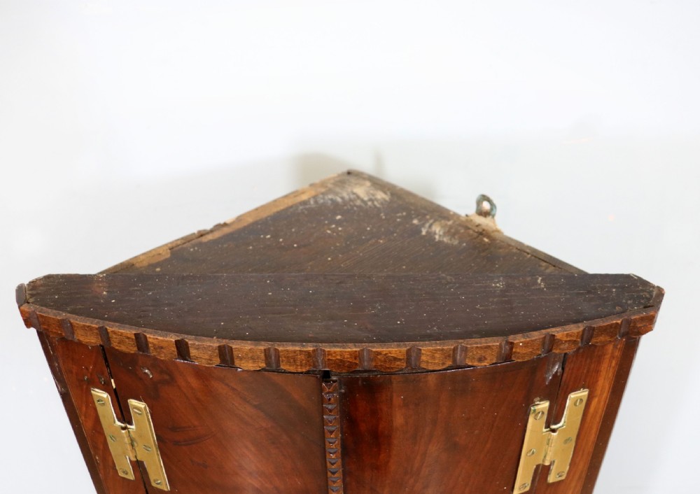  A lovely & extremely unusual Georgian bow front four door corner cabinet. View IX