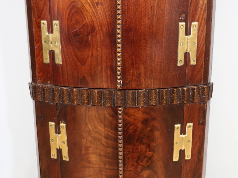  A lovely & extremely unusual Georgian bow front four door corner cabinet. View XII