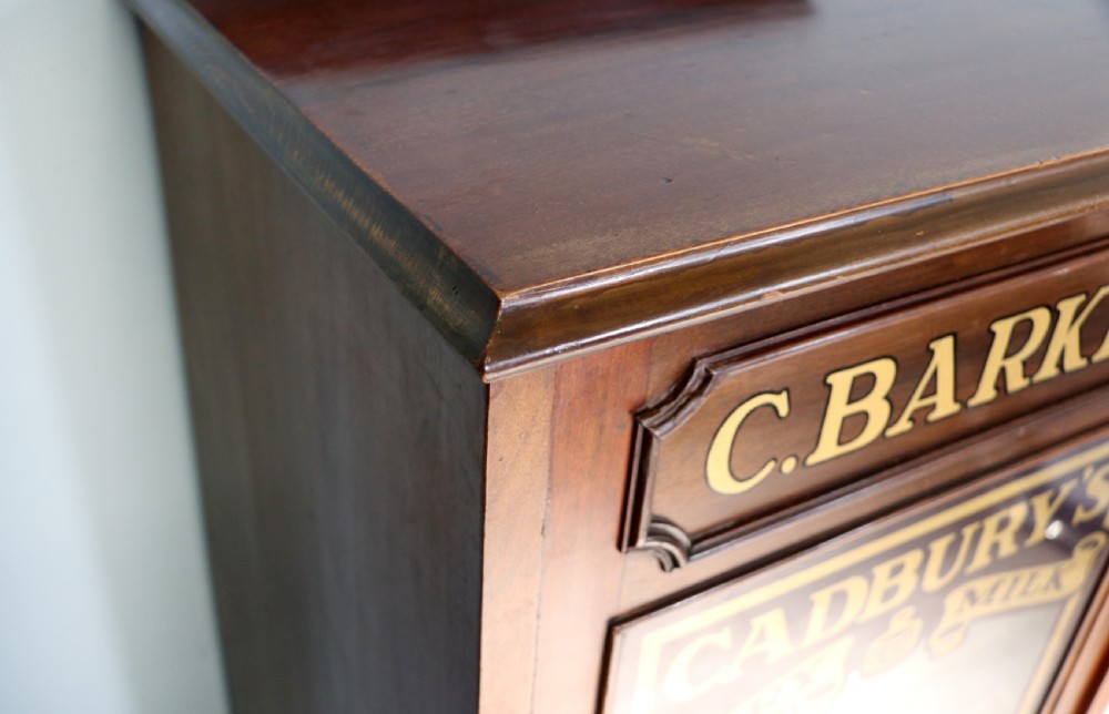 A lovely late Victorian glazed side cabinet sign written for Cadburys chocolate.  View X