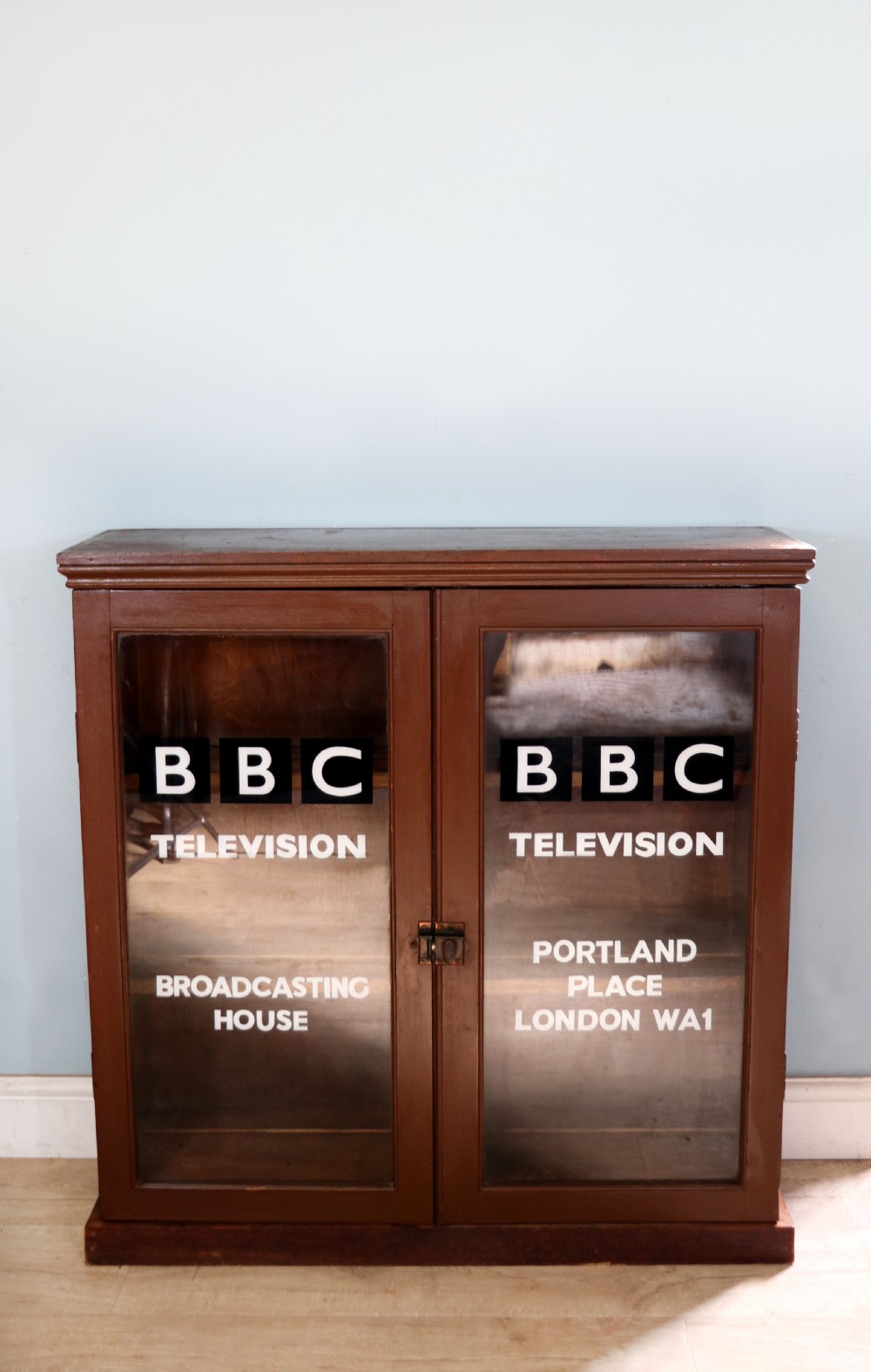 A lovely functional mid-century glazed bookcase cabinet sign written for the British Broadcasting company (BBC).  View II