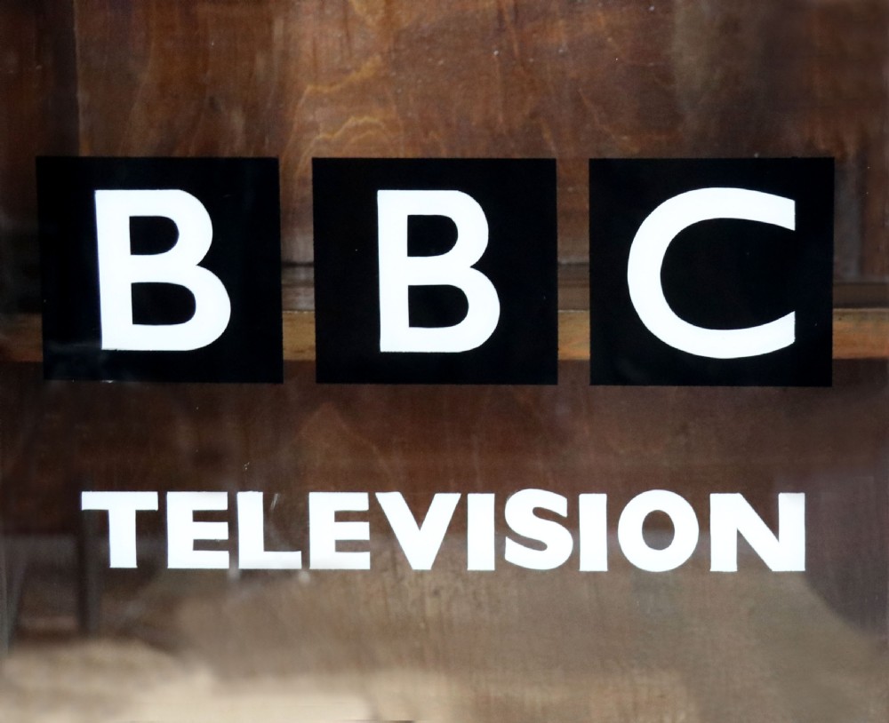 A lovely functional mid-century glazed bookcase cabinet sign written for the British Broadcasting company (BBC).  View V