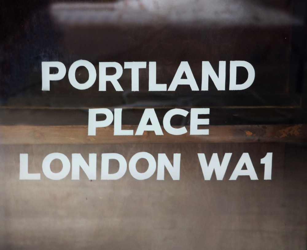 A lovely functional mid-century glazed bookcase cabinet sign written for the British Broadcasting company (BBC).  View VII
