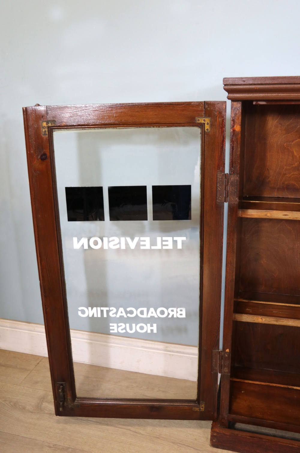 A lovely functional mid-century glazed bookcase cabinet sign written for the British Broadcasting company (BBC).  View VIII