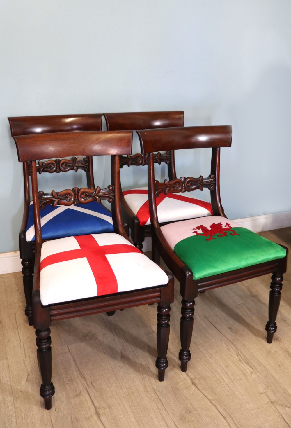 A set of four Victorian mahogany bar-back dining chairs with carved mid-rails, turned front legs, and flag-patterned upholstered seats. View III