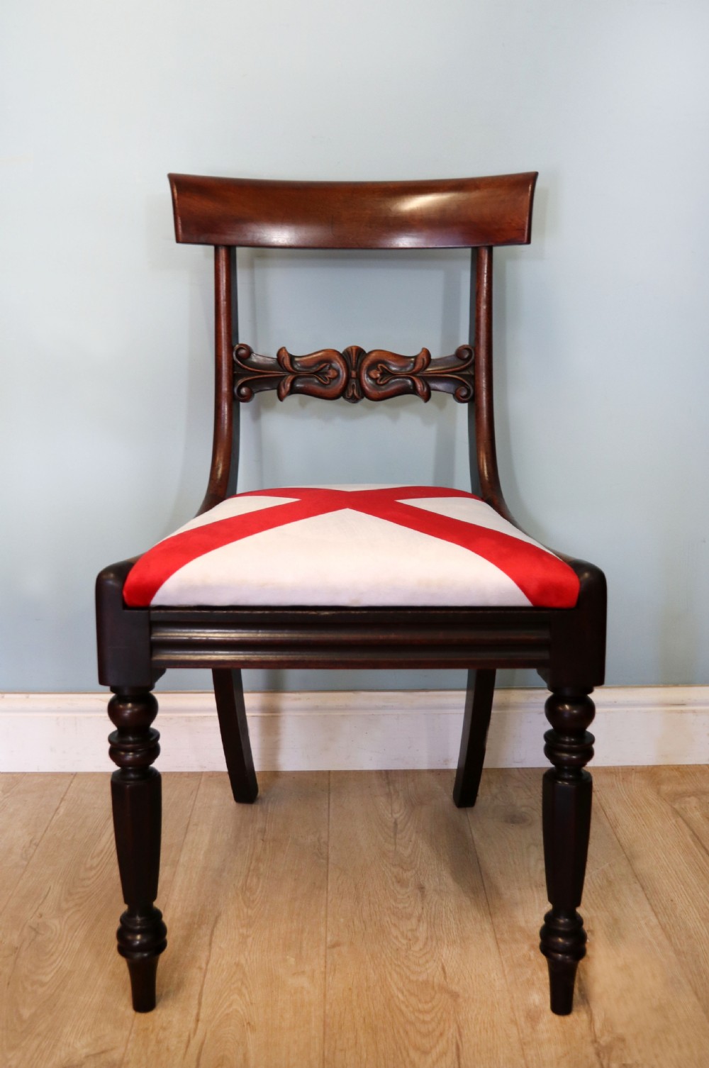 A set of four Victorian mahogany bar-back dining chairs with carved mid-rails, turned front legs, and flag-patterned upholstered seats. View IV