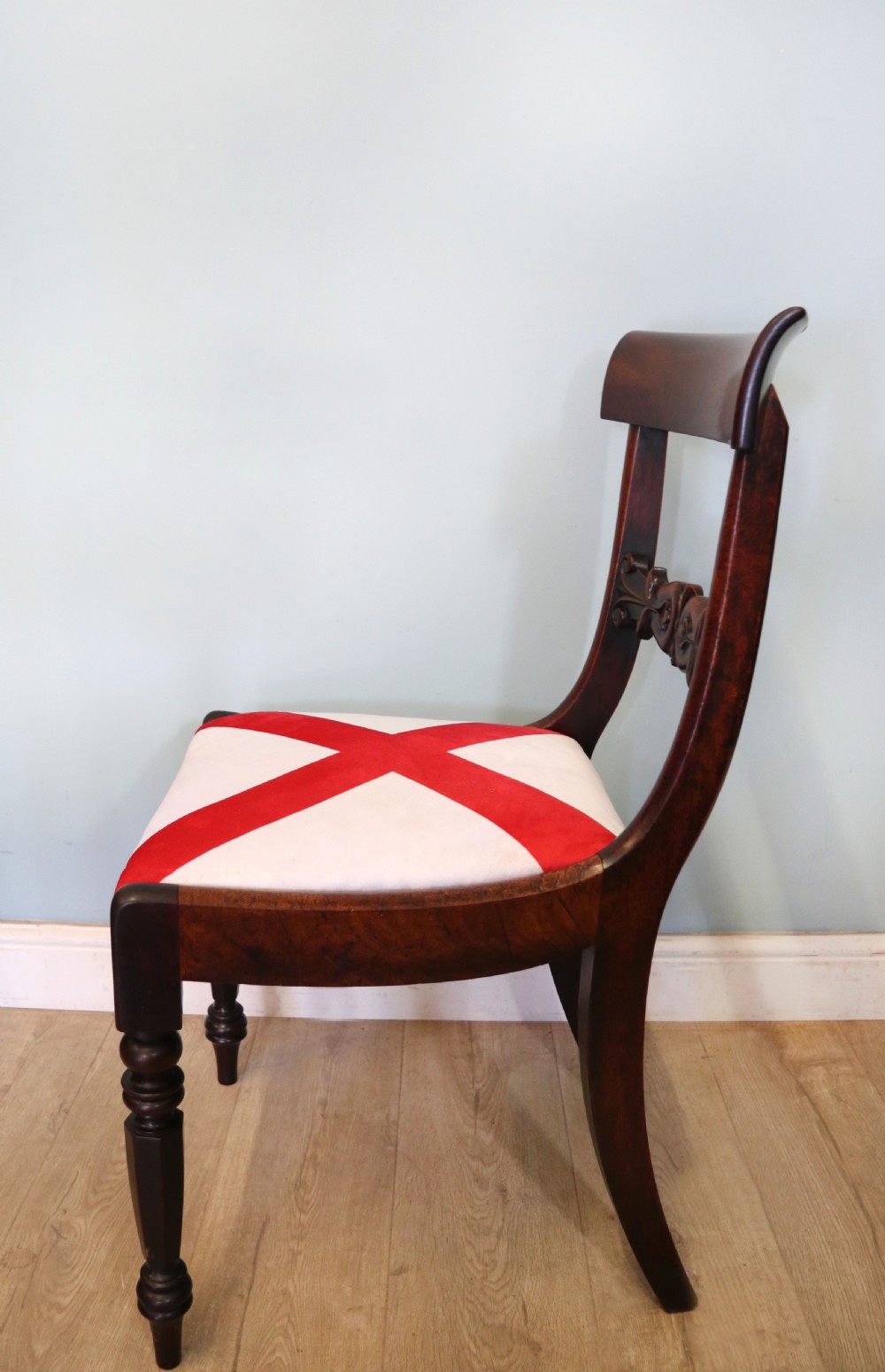 A set of four Victorian mahogany bar-back dining chairs with carved mid-rails, turned front legs, and flag-patterned upholstered seats. View VI