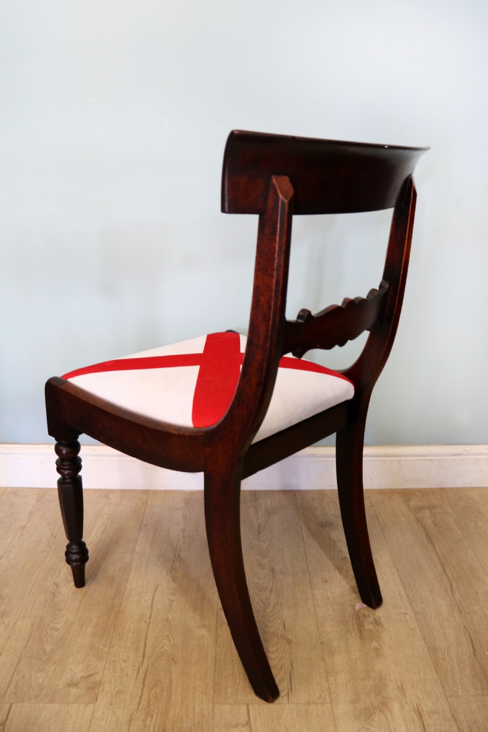 A set of four Victorian mahogany bar-back dining chairs with carved mid-rails, turned front legs, and flag-patterned upholstered seats. View VII
