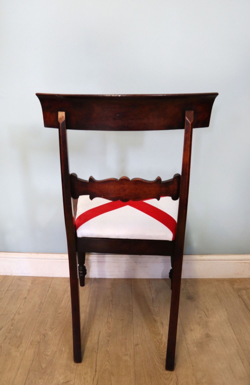A set of four Victorian mahogany bar-back dining chairs with carved mid-rails, turned front legs, and flag-patterned upholstered seats. View VIII