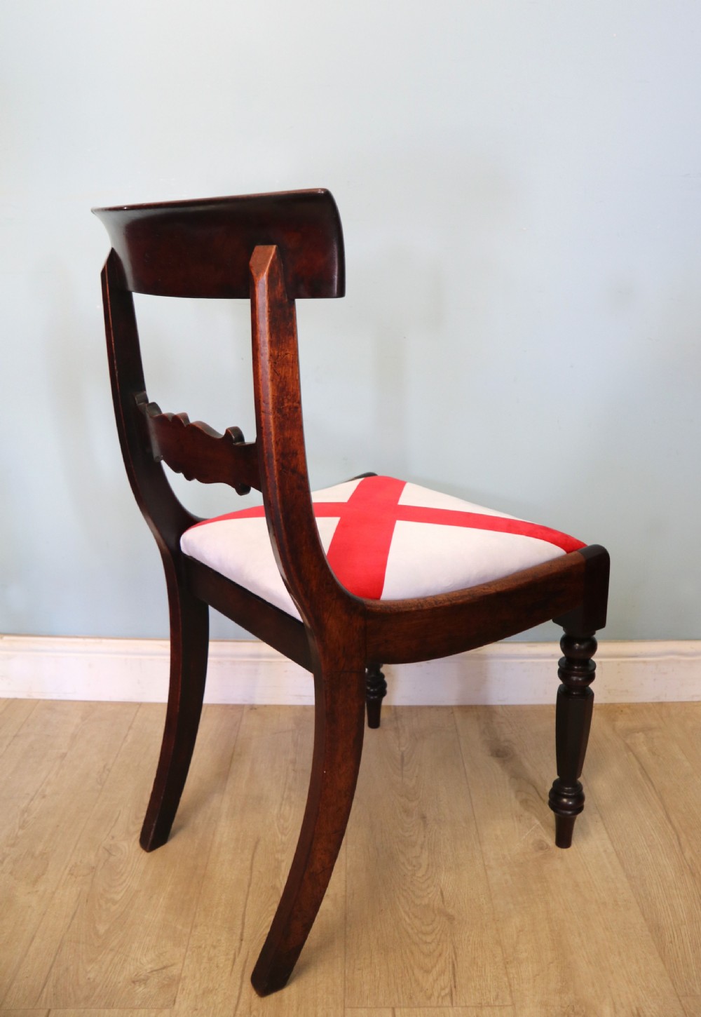 A set of four Victorian mahogany bar-back dining chairs with carved mid-rails, turned front legs, and flag-patterned upholstered seats. View IX