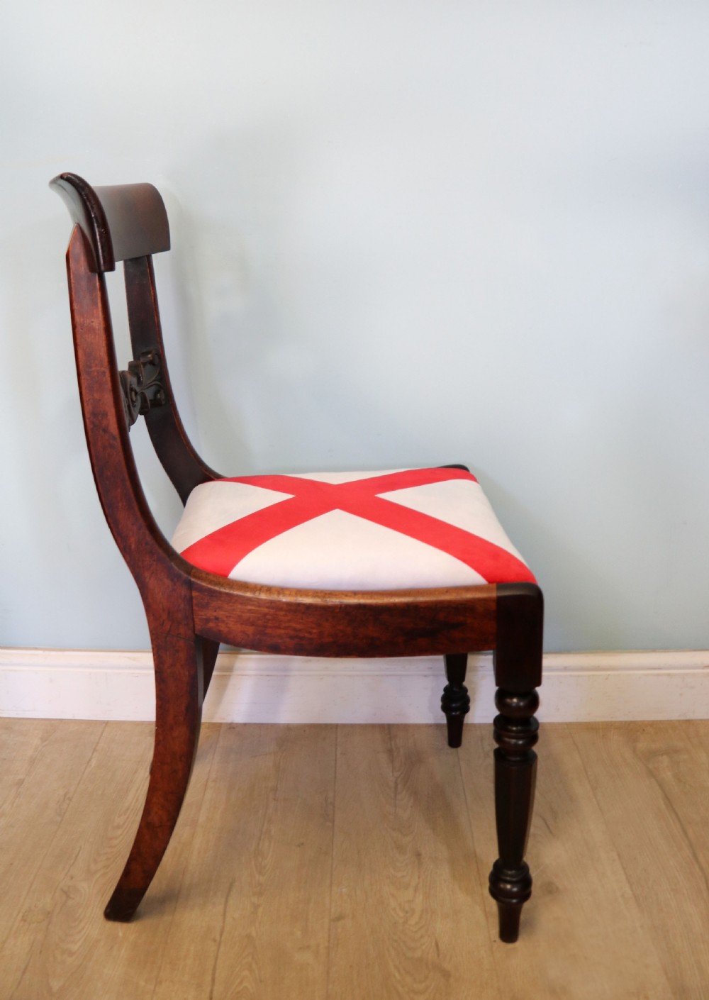 A set of four Victorian mahogany bar-back dining chairs with carved mid-rails, turned front legs, and flag-patterned upholstered seats. View X