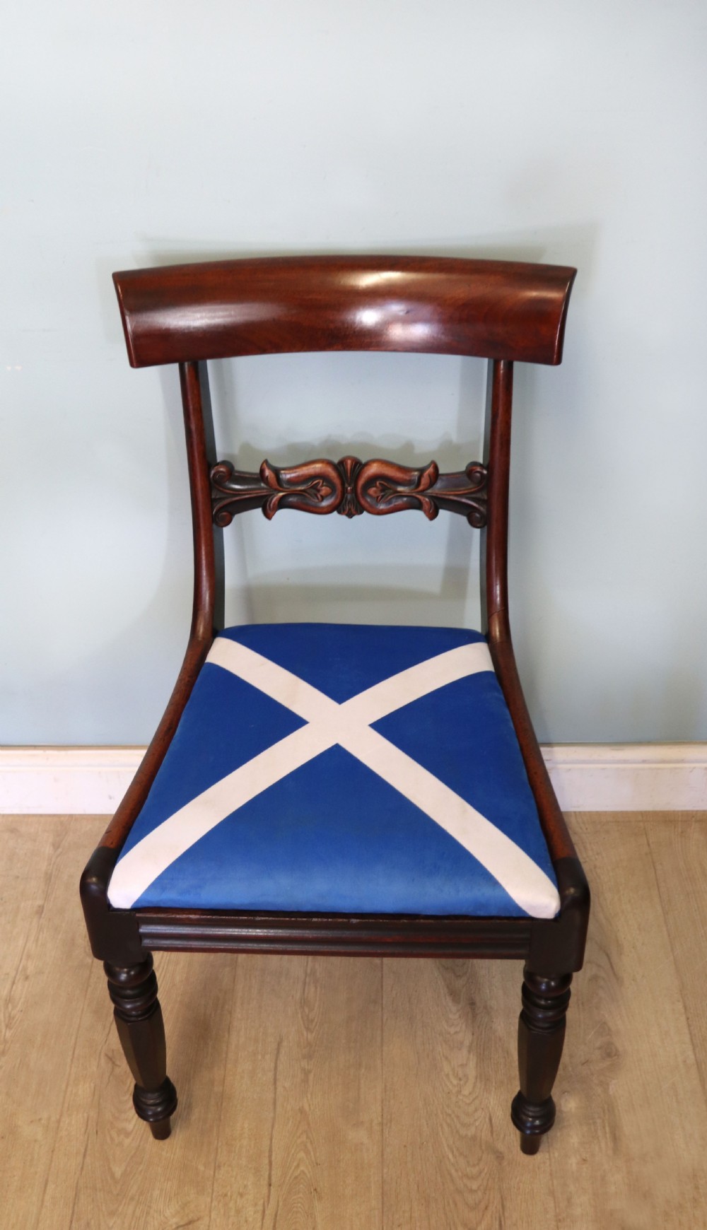A set of four Victorian mahogany bar-back dining chairs with carved mid-rails, turned front legs, and flag-patterned upholstered seats. View XII
