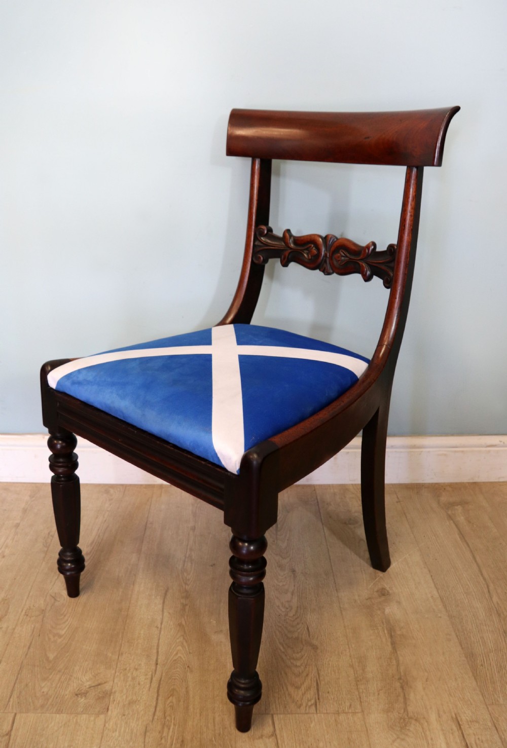 A set of four Victorian mahogany bar-back dining chairs with carved mid-rails, turned front legs, and flag-patterned upholstered seats. View XIV