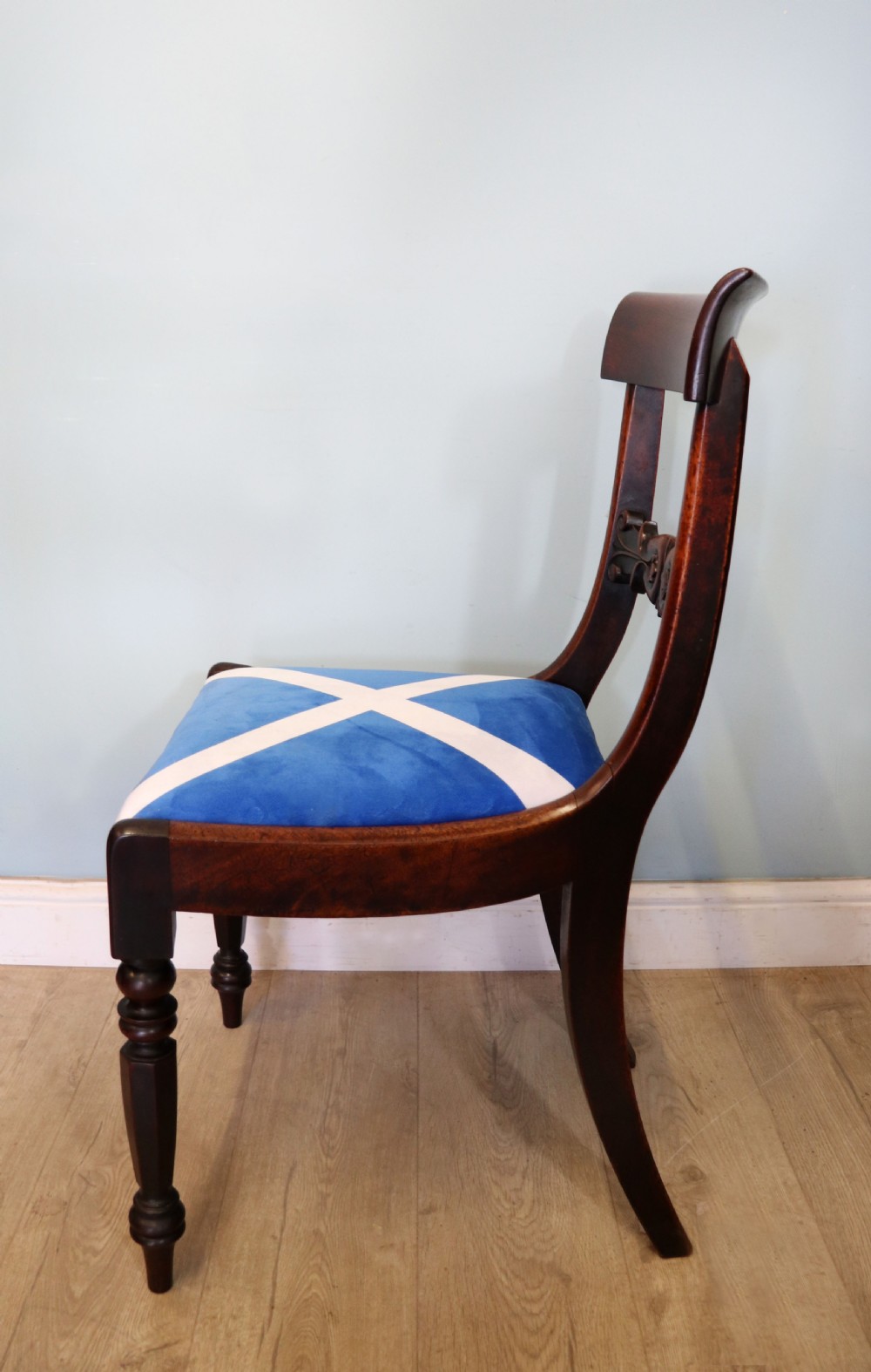 A set of four Victorian mahogany bar-back dining chairs with carved mid-rails, turned front legs, and flag-patterned upholstered seats. View XV