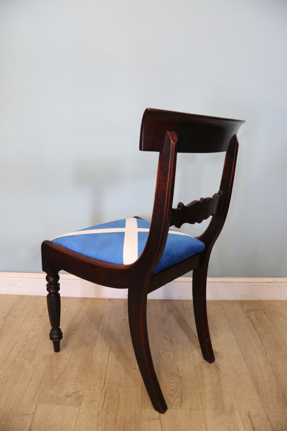 A set of four Victorian mahogany bar-back dining chairs with carved mid-rails, turned front legs, and flag-patterned upholstered seats. View XVI
