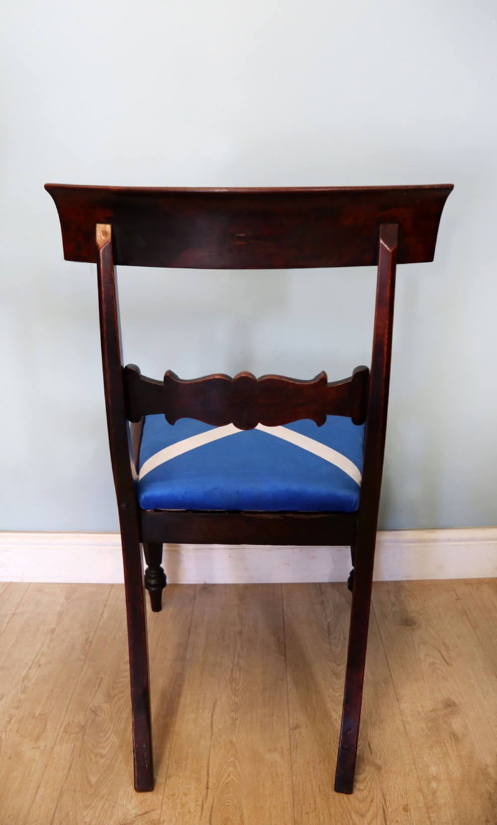 A set of four Victorian mahogany bar-back dining chairs with carved mid-rails, turned front legs, and flag-patterned upholstered seats. View XVII