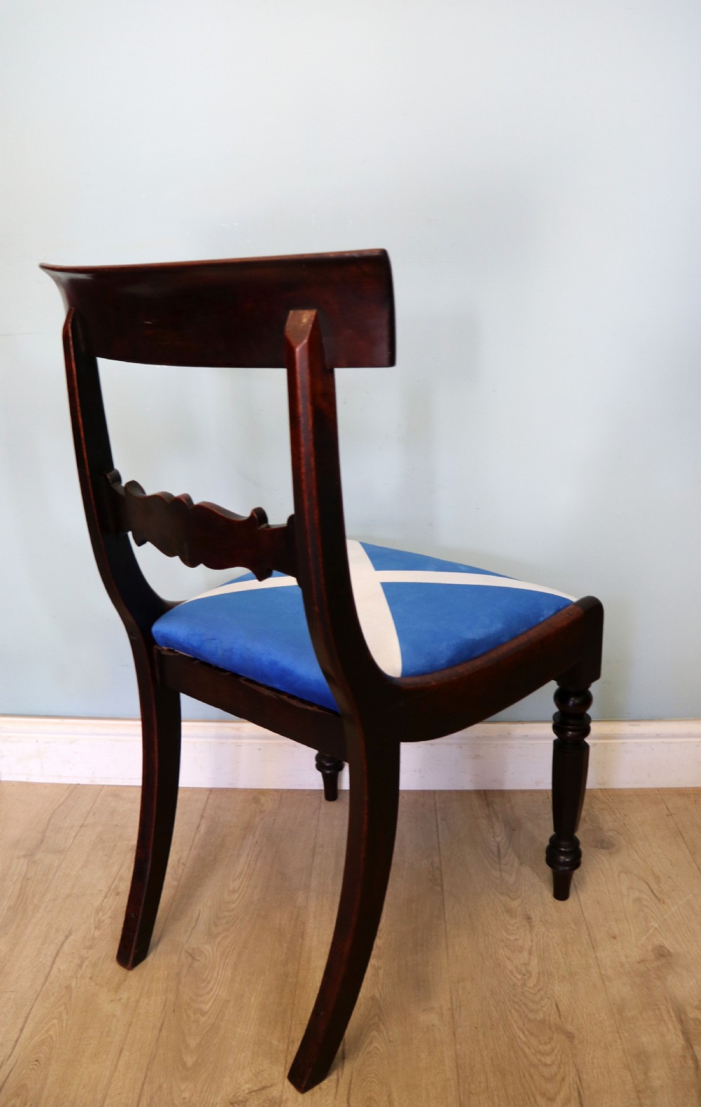 A set of four Victorian mahogany bar-back dining chairs with carved mid-rails, turned front legs, and flag-patterned upholstered seats. View XVIII