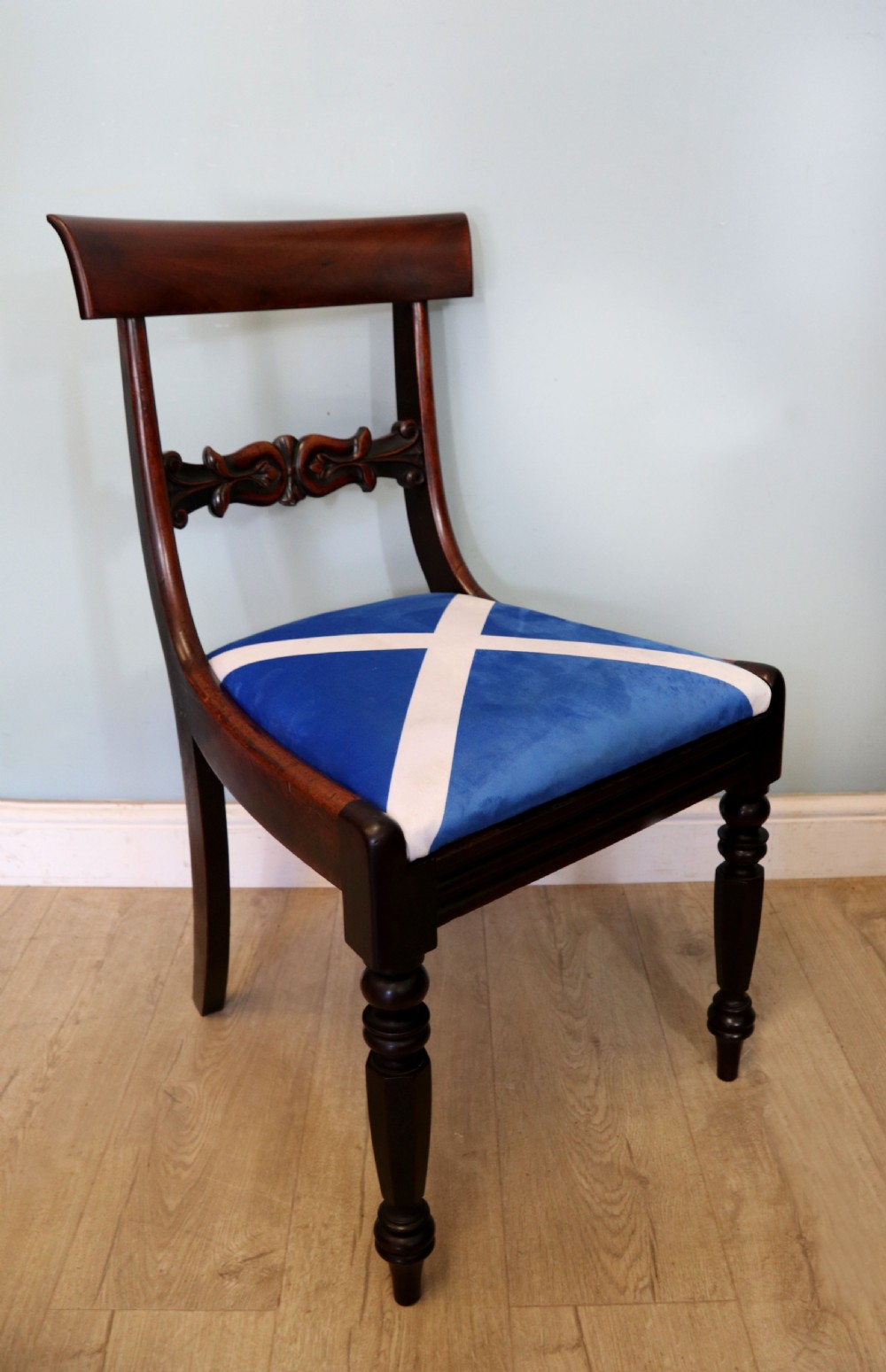 A set of four Victorian mahogany bar-back dining chairs with carved mid-rails, turned front legs, and flag-patterned upholstered seats. View XX