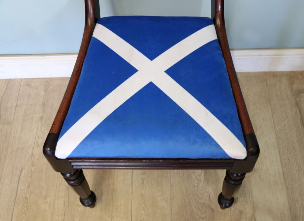 A set of four Victorian mahogany bar-back dining chairs with carved mid-rails, turned front legs, and flag-patterned upholstered seats. View XXI