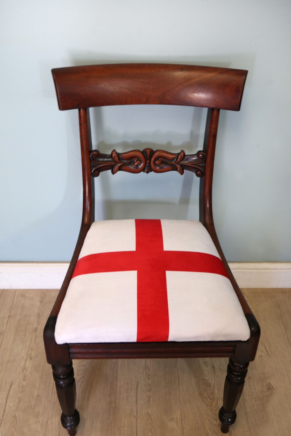 A set of four Victorian mahogany bar-back dining chairs with carved mid-rails, turned front legs, and flag-patterned upholstered seats. View XXIV