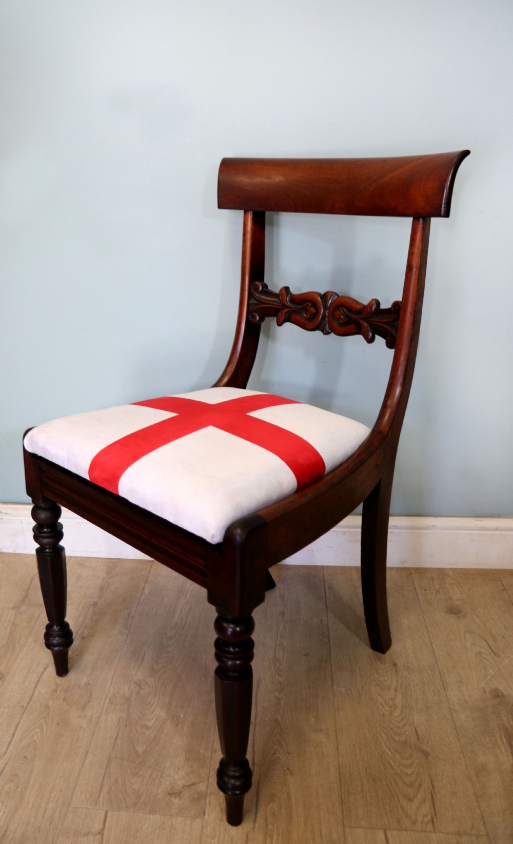 A set of four Victorian mahogany bar-back dining chairs with carved mid-rails, turned front legs, and flag-patterned upholstered seats. View XXV