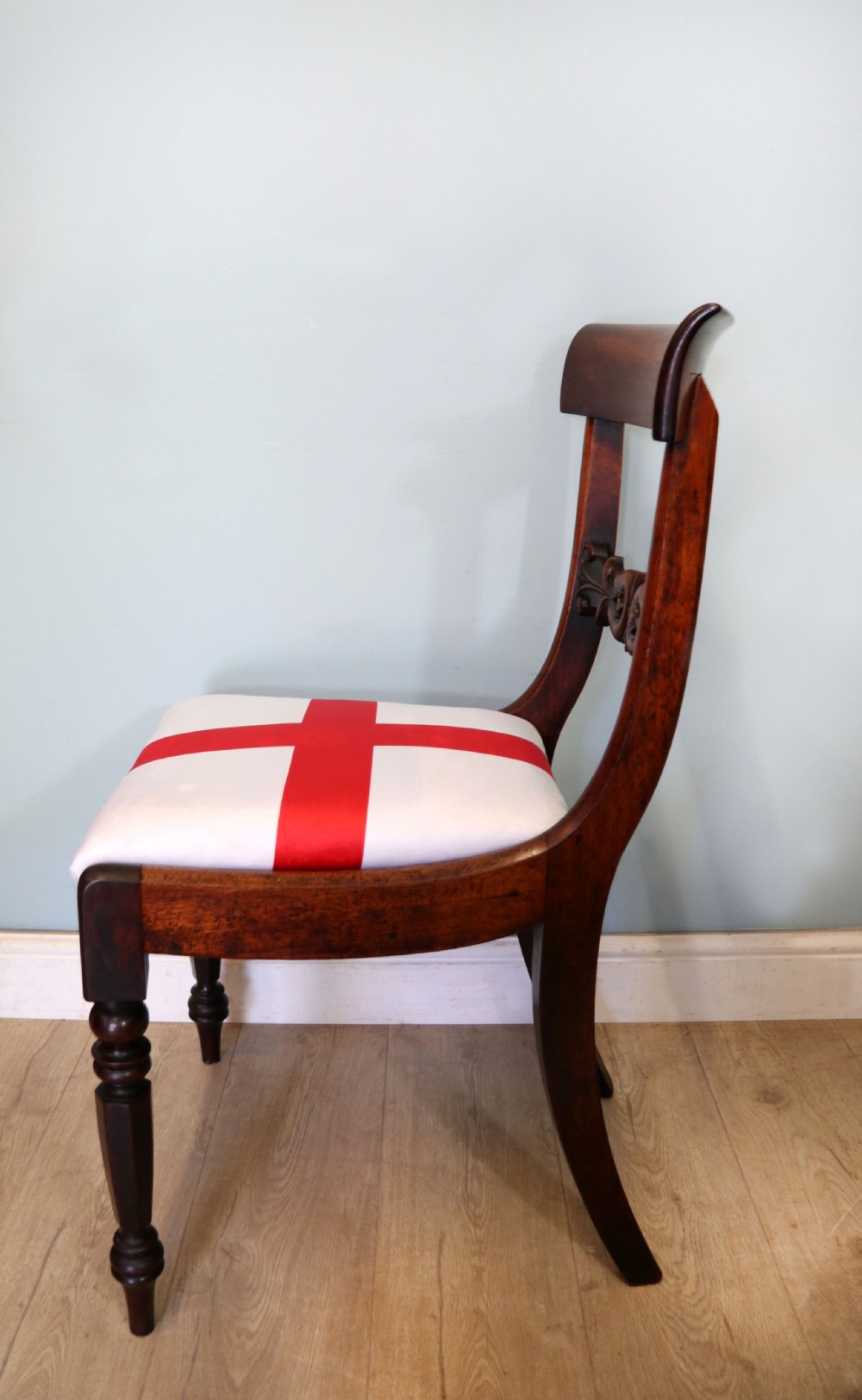 A set of four Victorian mahogany bar-back dining chairs with carved mid-rails, turned front legs, and flag-patterned upholstered seats. View XXVI