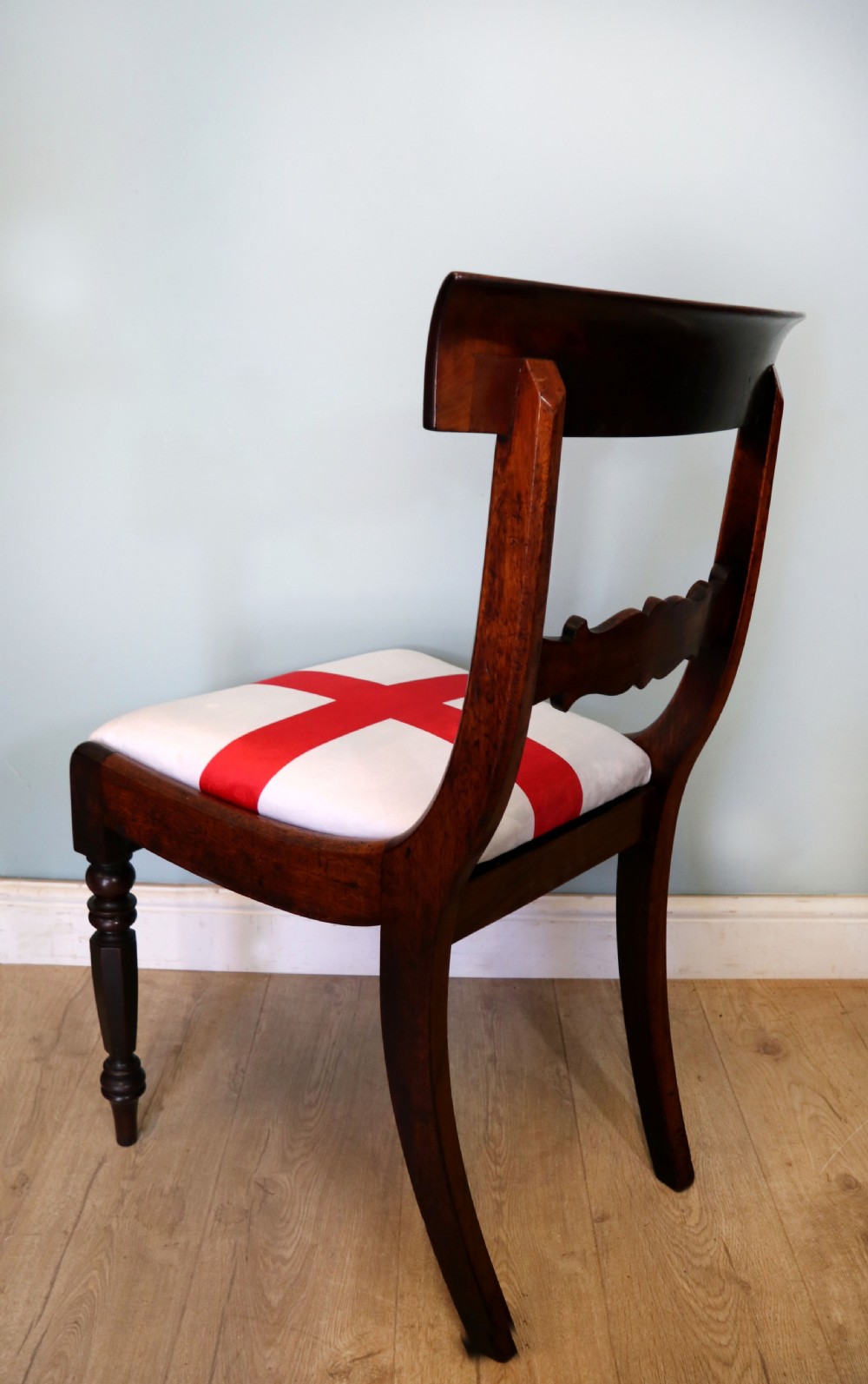 A set of four Victorian mahogany bar-back dining chairs with carved mid-rails, turned front legs, and flag-patterned upholstered seats. View XXVII