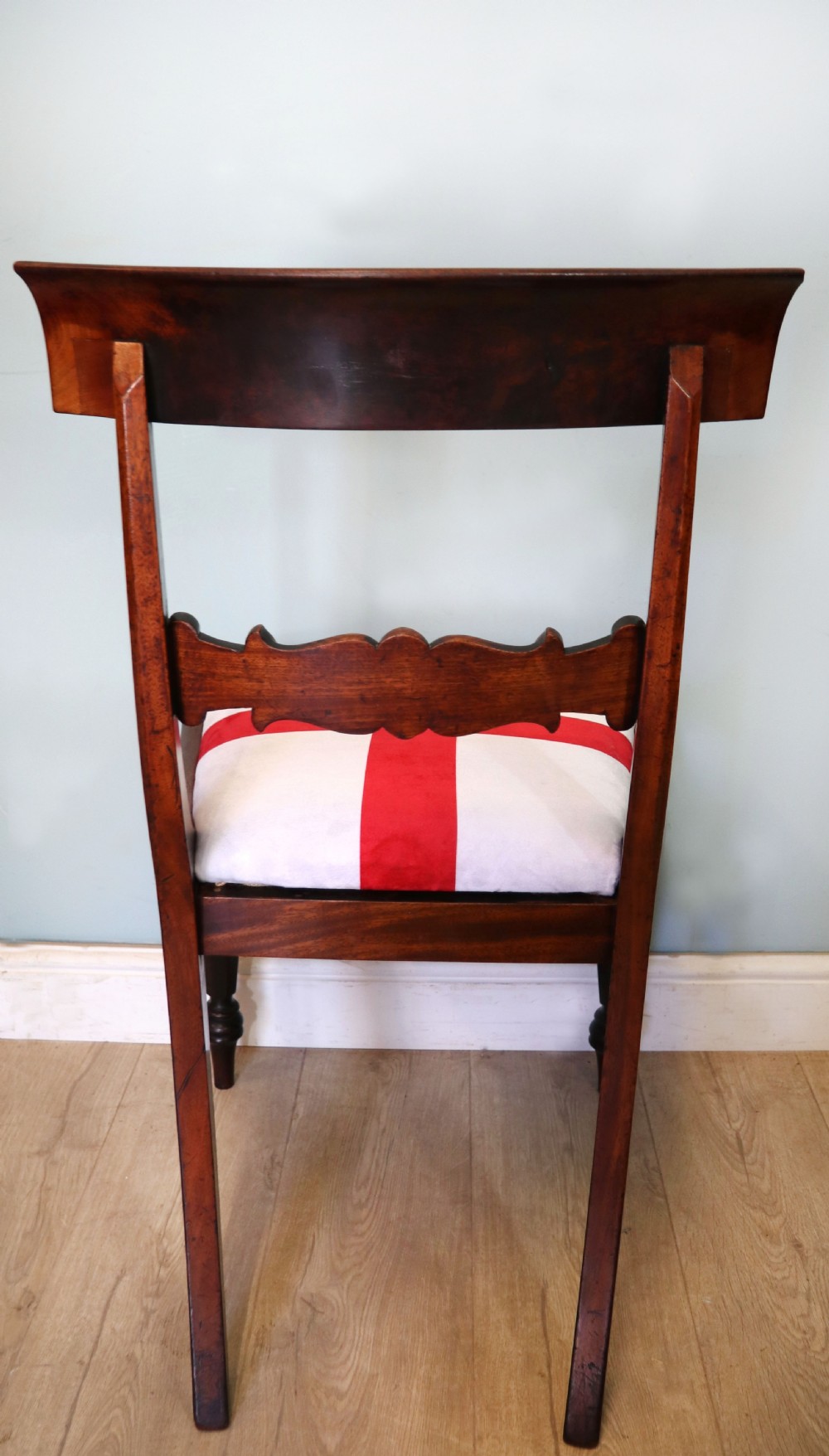 A set of four Victorian mahogany bar-back dining chairs with carved mid-rails, turned front legs, and flag-patterned upholstered seats. View XXVIII