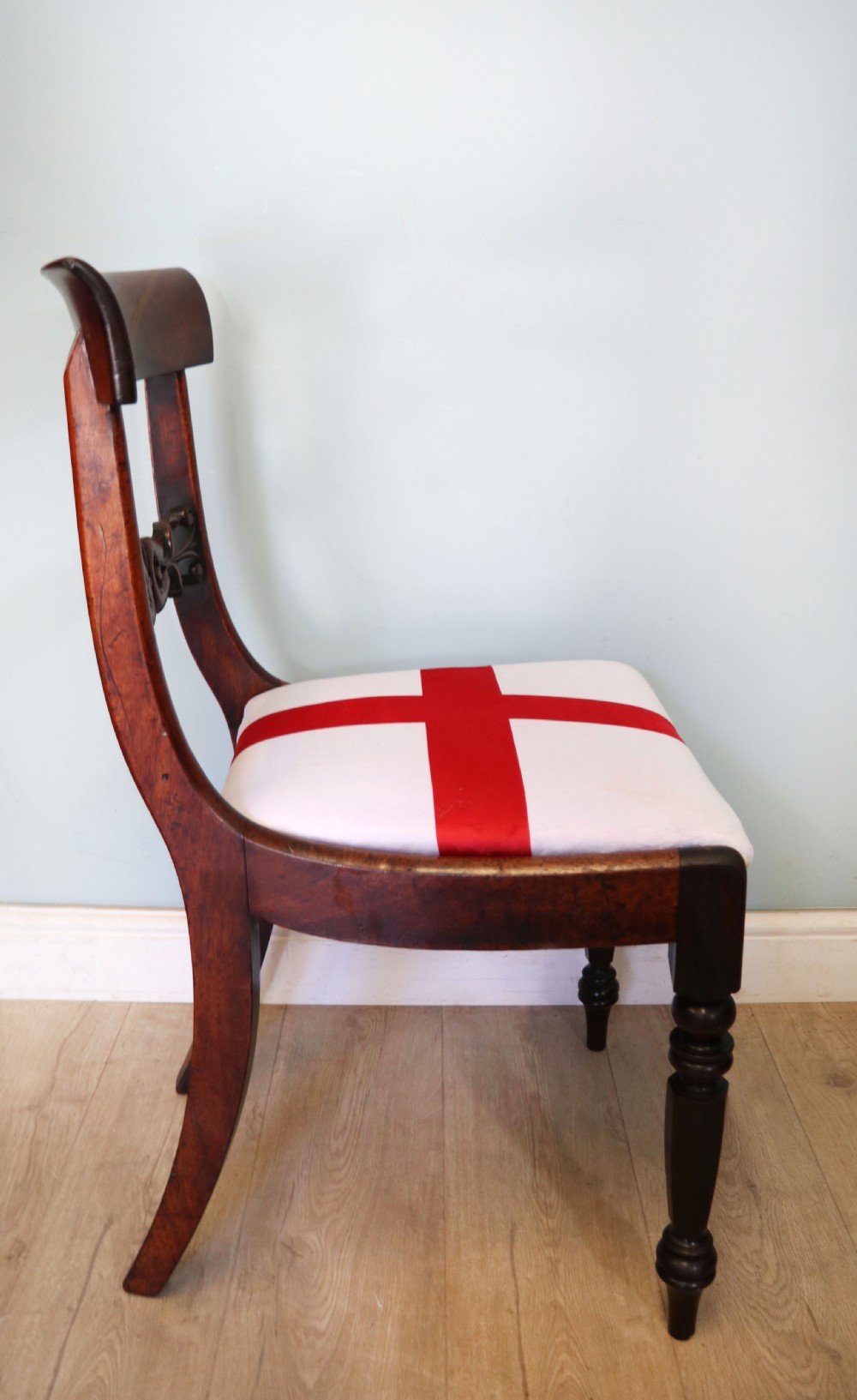 A set of four Victorian mahogany bar-back dining chairs with carved mid-rails, turned front legs, and flag-patterned upholstered seats. View XXIX