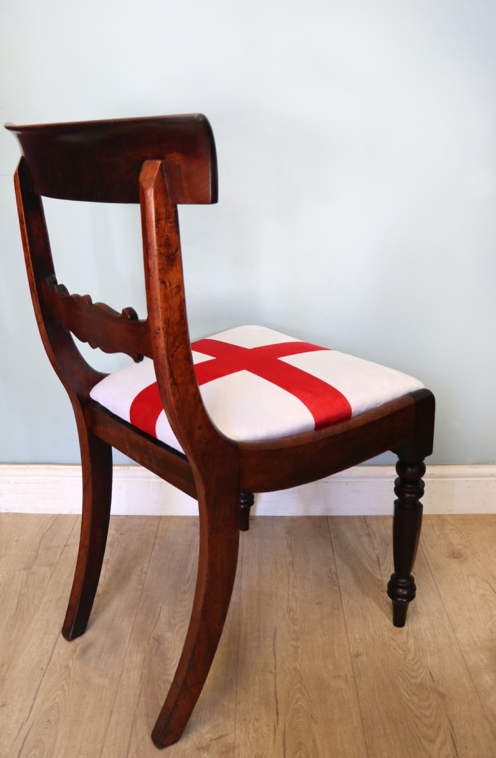 A set of four Victorian mahogany bar-back dining chairs with carved mid-rails, turned front legs, and flag-patterned upholstered seats. View XXX