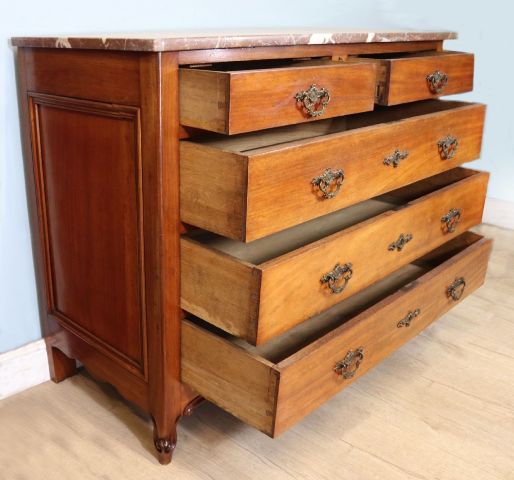 A lovely late 19th century French walnut marble topped chest. View IV