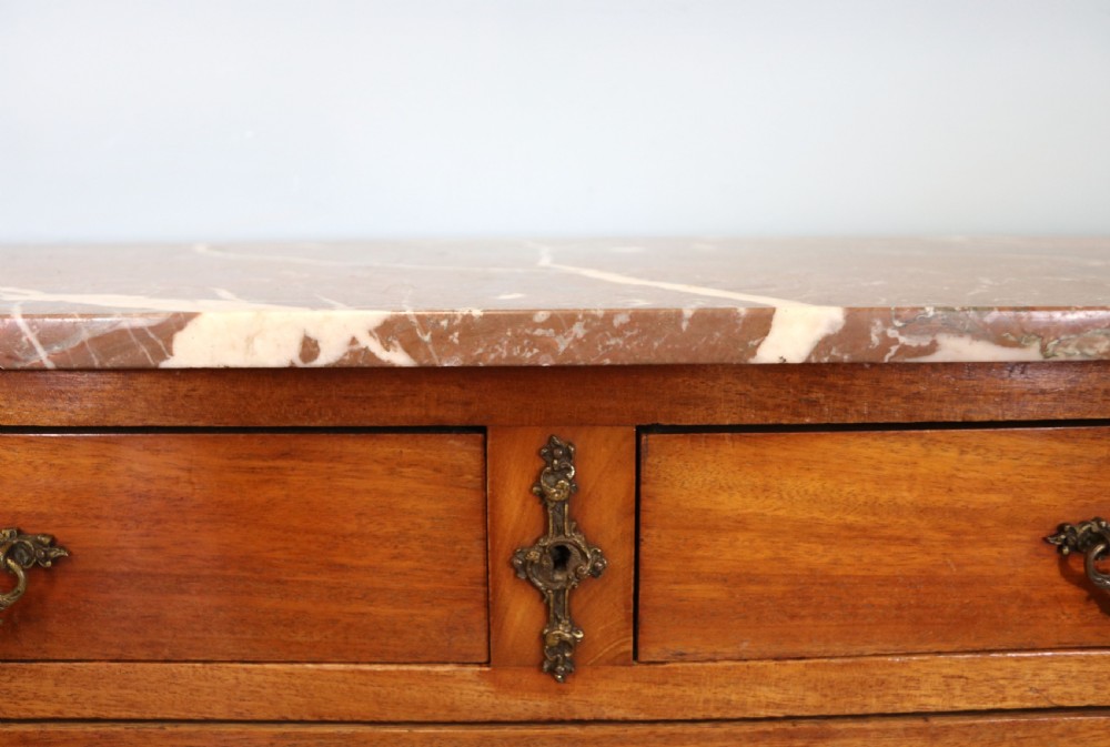 A lovely late 19th century French walnut marble topped chest. View VIII