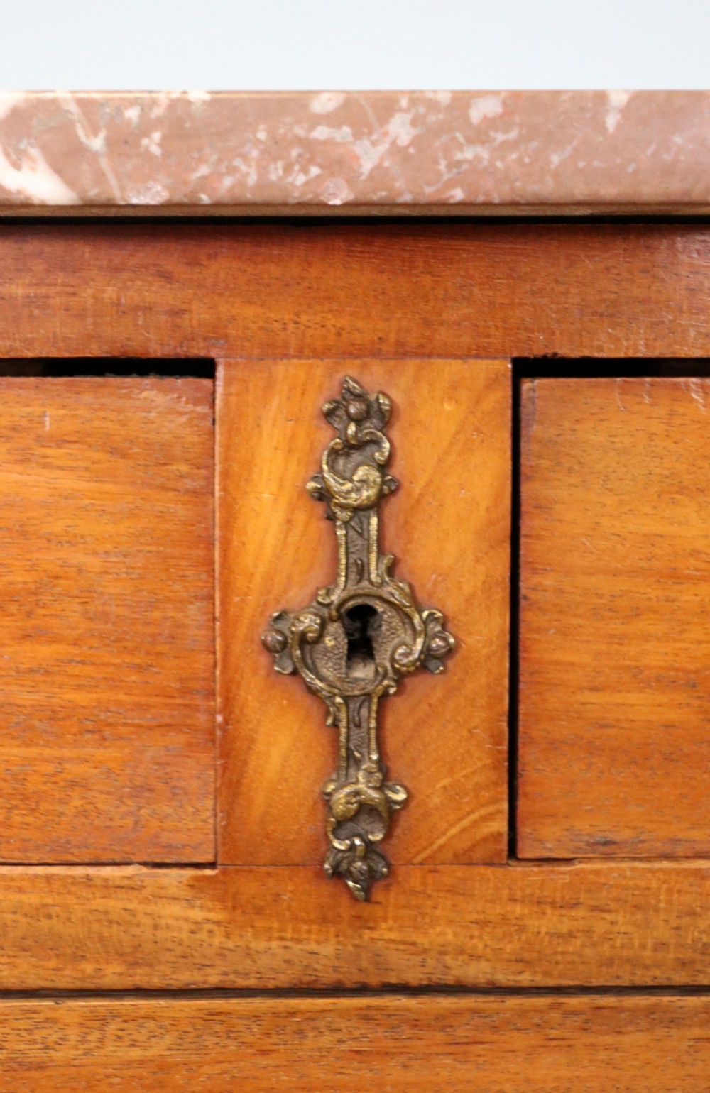 A lovely late 19th century French walnut marble topped chest. View IX