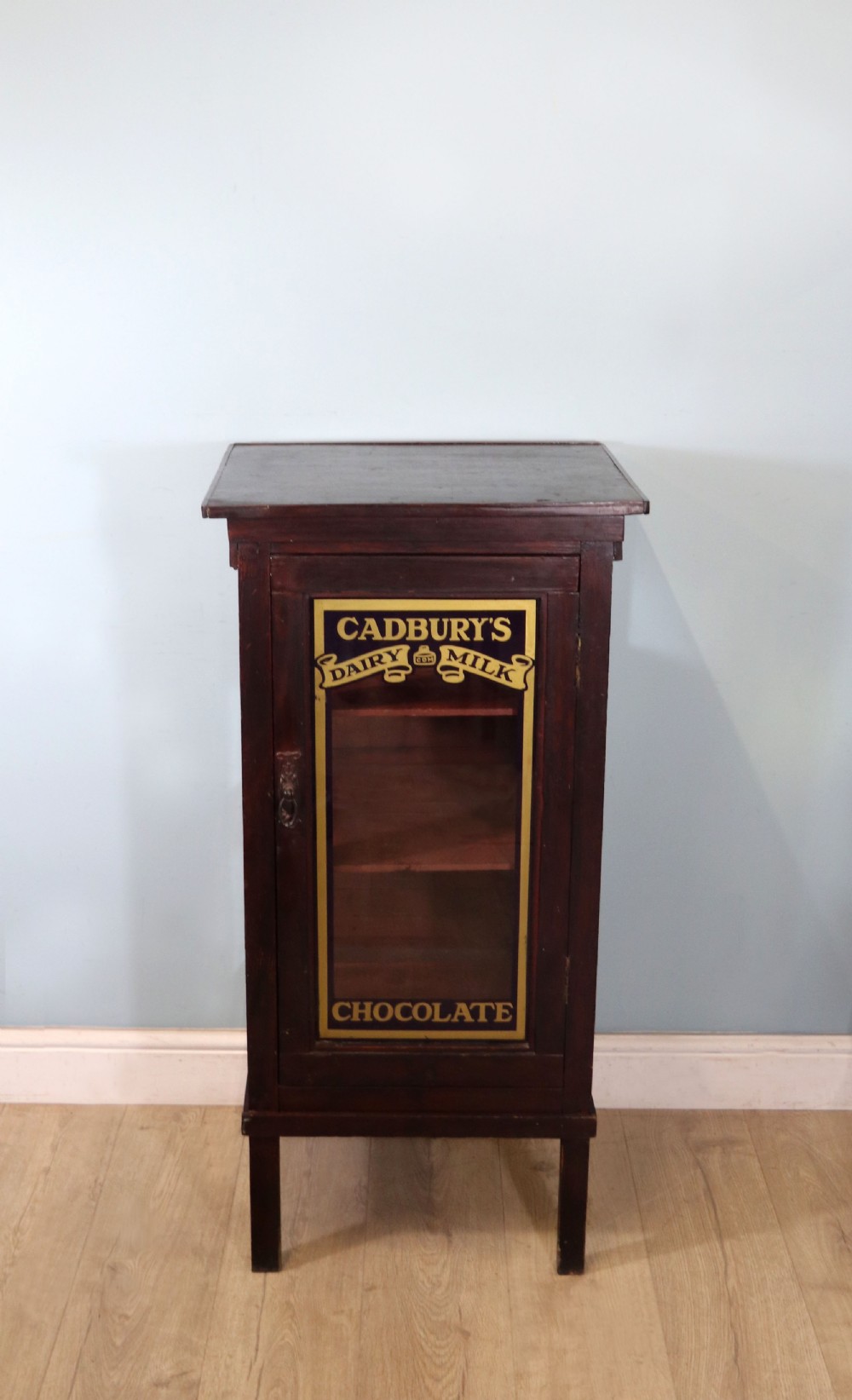  A lovely well used shop cabinet sign written Cadbury's Chocolate.