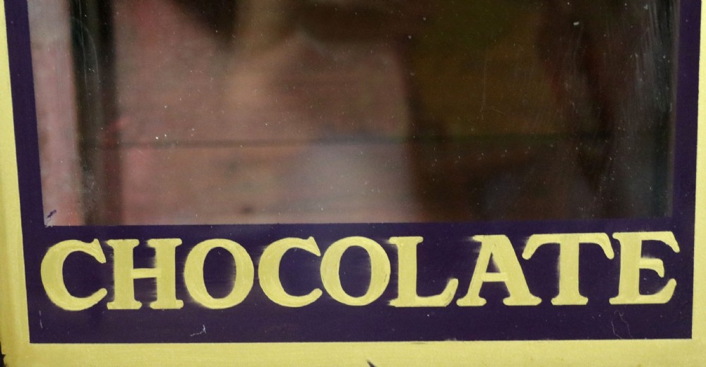  A lovely well used shop cabinet sign written Cadbury's Chocolate. View XIV