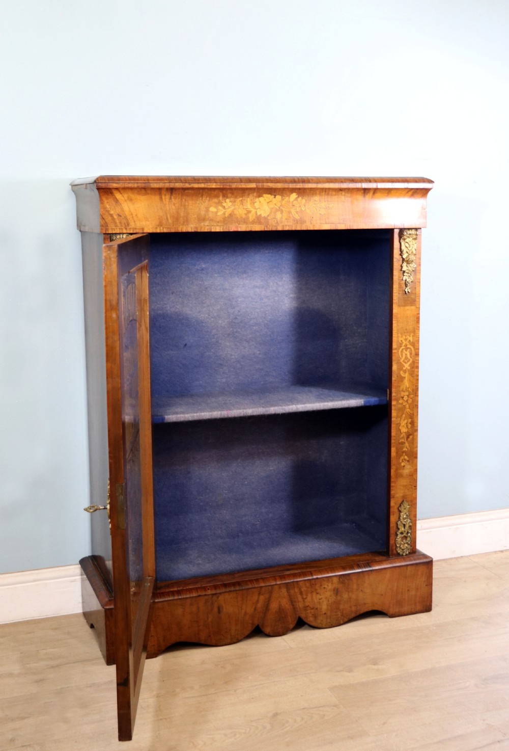 A lovely Victorian walnut and floral inlaid pier cabinet, later sign written in French with Champagne advertising. View IV