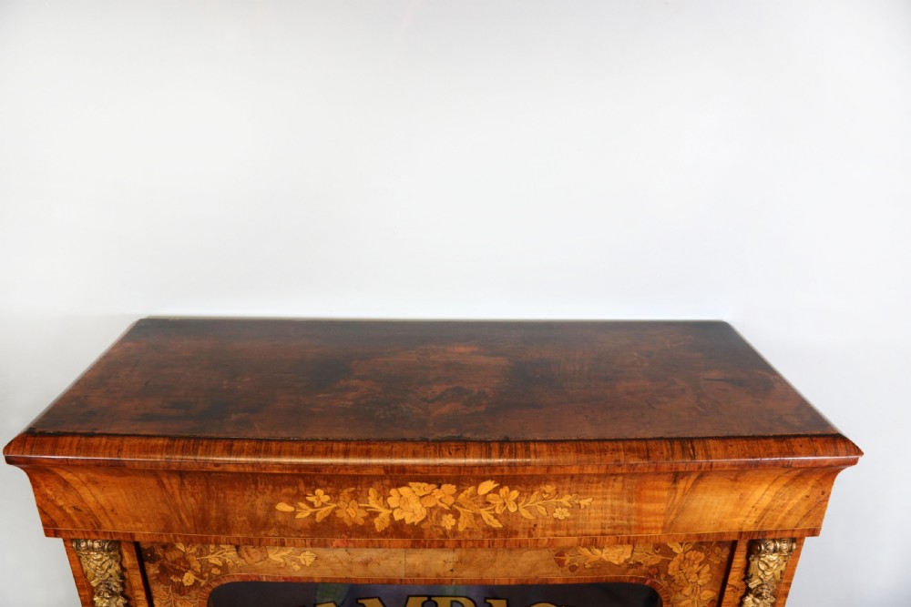 A lovely Victorian walnut and floral inlaid pier cabinet, later sign written in French with Champagne advertising. View VI