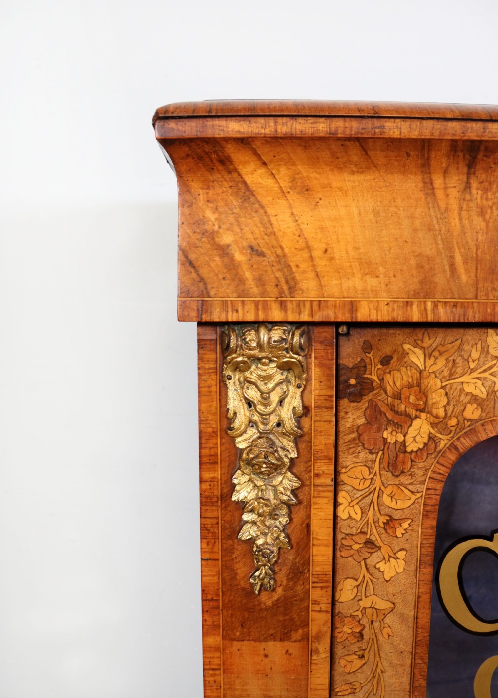 A lovely Victorian walnut and floral inlaid pier cabinet, later sign written in French with Champagne advertising. View IX